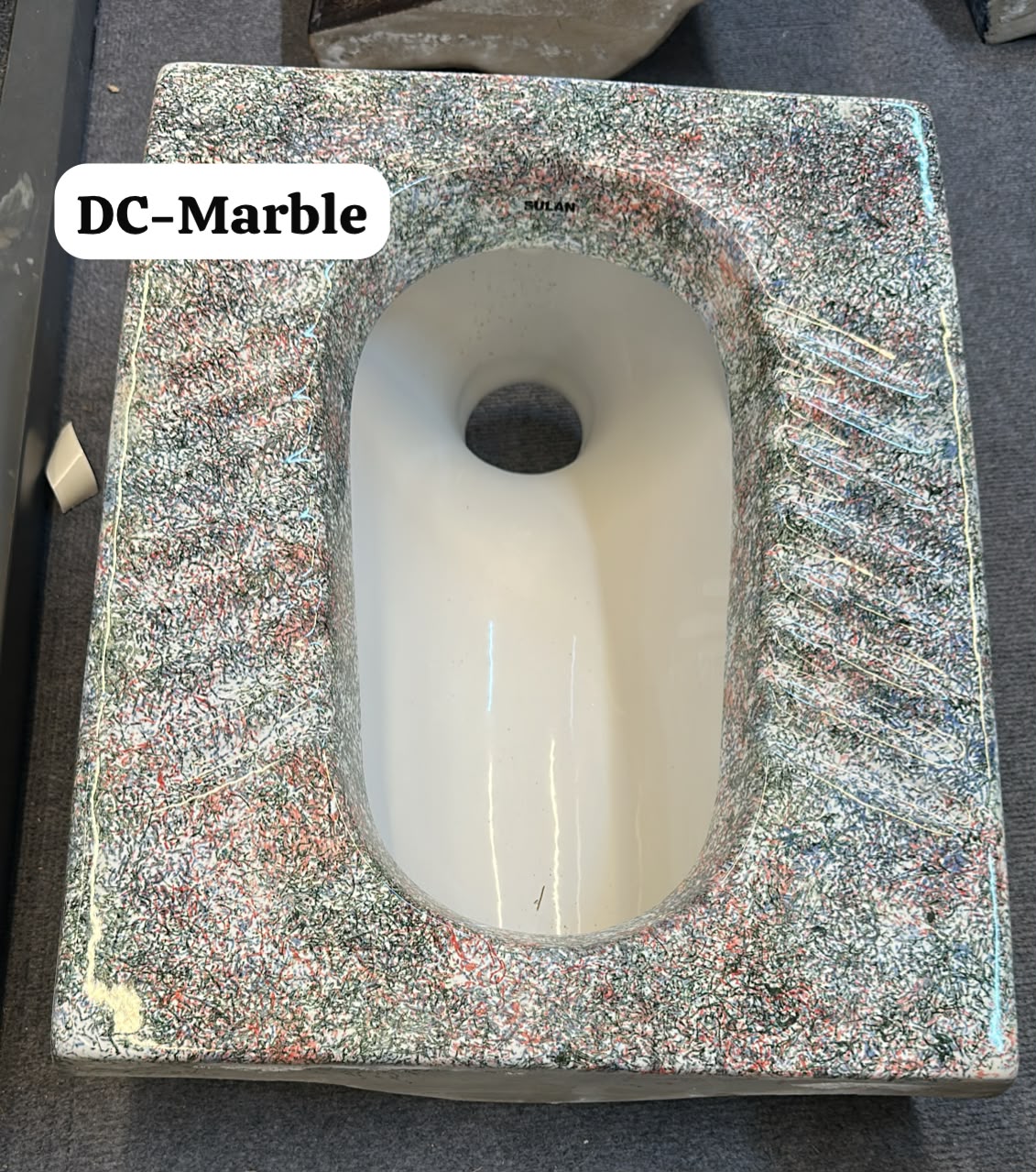 MARBLE SQUAT TOILET.